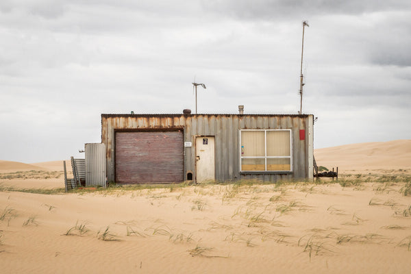 A weathered corrugated-iron shack at Tin City in the Stockton Bight dunes, Port Stephens NSW