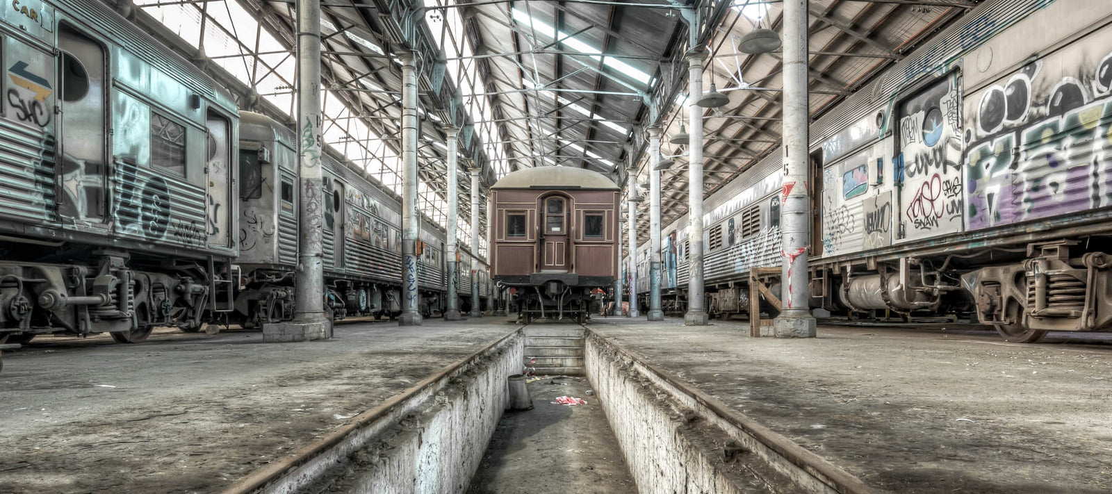 Historic train carriages inside the Eveleigh Paint Shop, meticulously preserved as part of Sydney’s rich railway heritage.