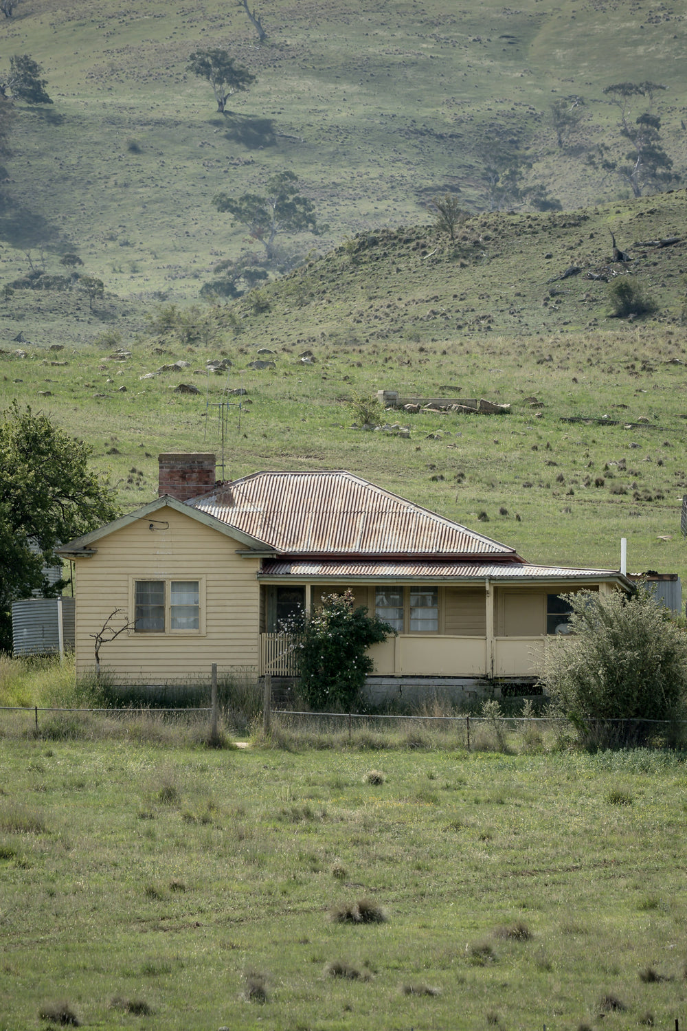 Boco Homestead at A Place to Call Home, an abandoned weatherboard farmstesd perched on a hillside.