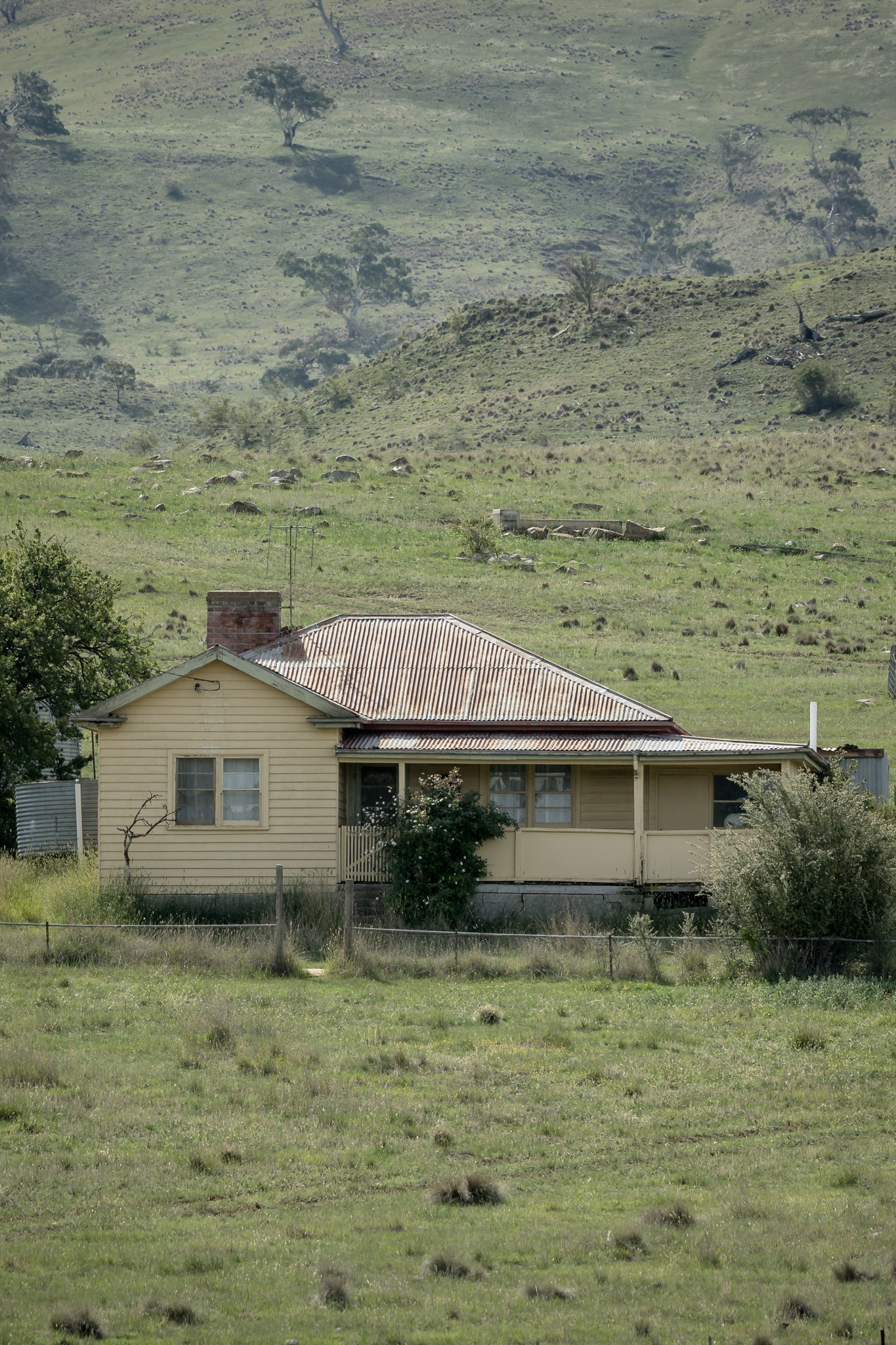 Boco Homestead at A Place to Call Home, an abandoned weatherboard farmstesd perched on a hillside.