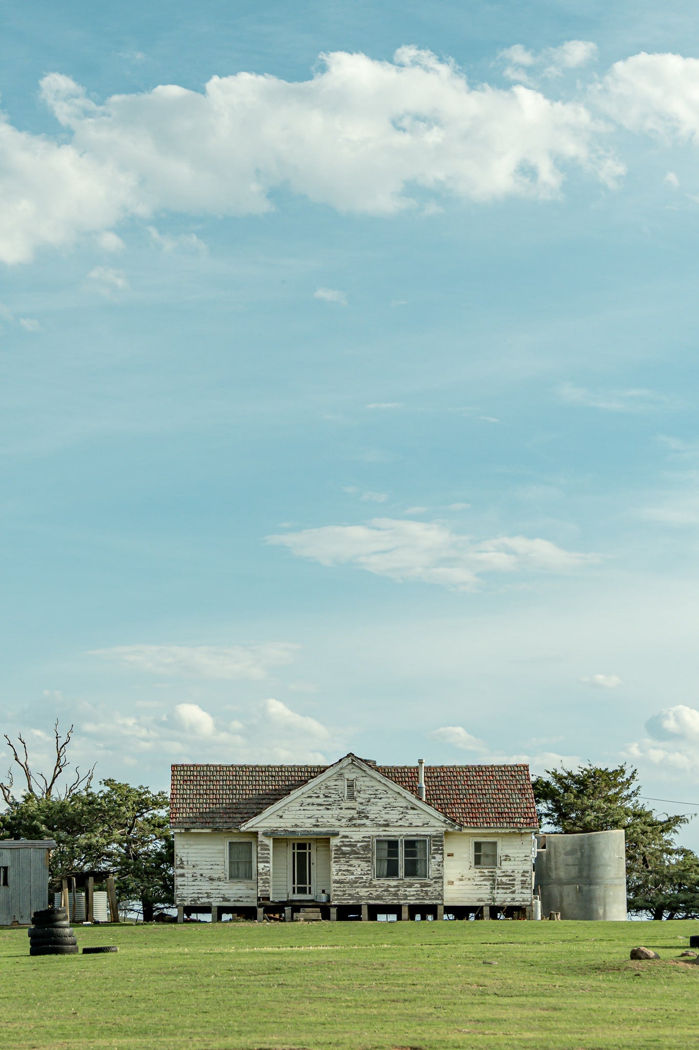 Dalgety Homestead at A Place to Call Home, a weathered cottage perched atop a gentle hill in Dalgety.