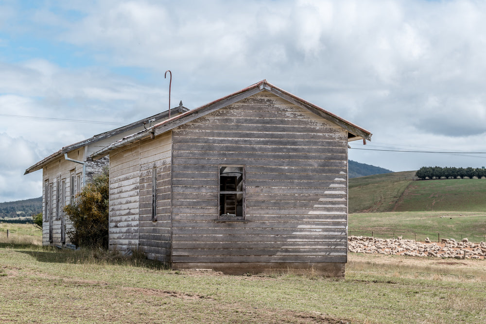 Delegate Shearers Quarters at A Place to Call Home, the end of a weatherboard clad shearers quarters on the outskirts.