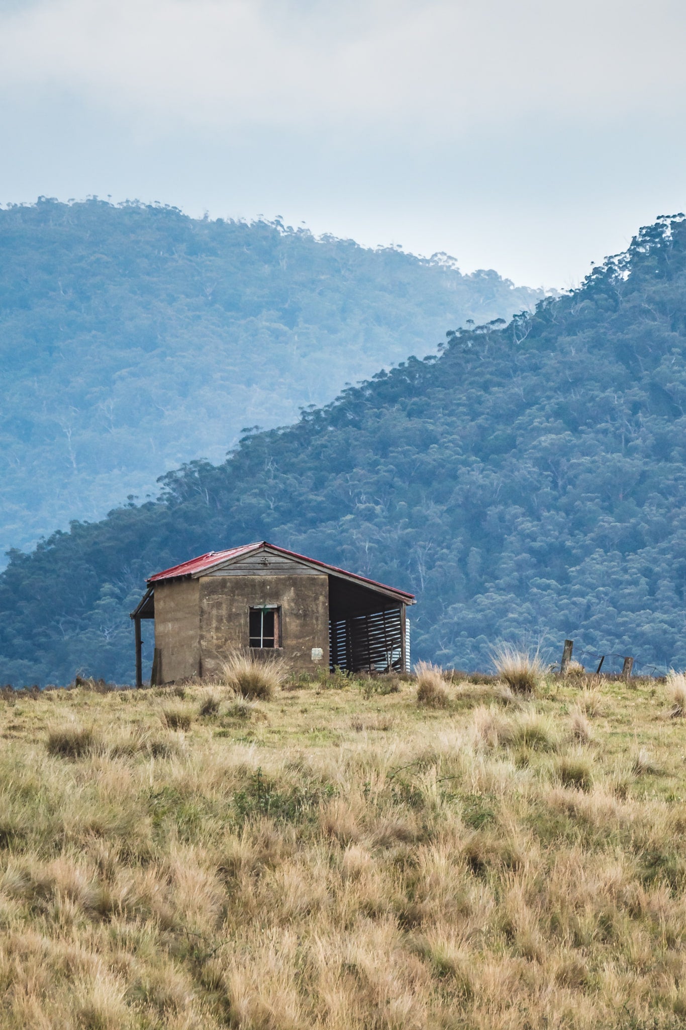 House On The Hill at A Place to Call Home, a single concrete structure sits on an exposed ridge above the Snowy Mountains.