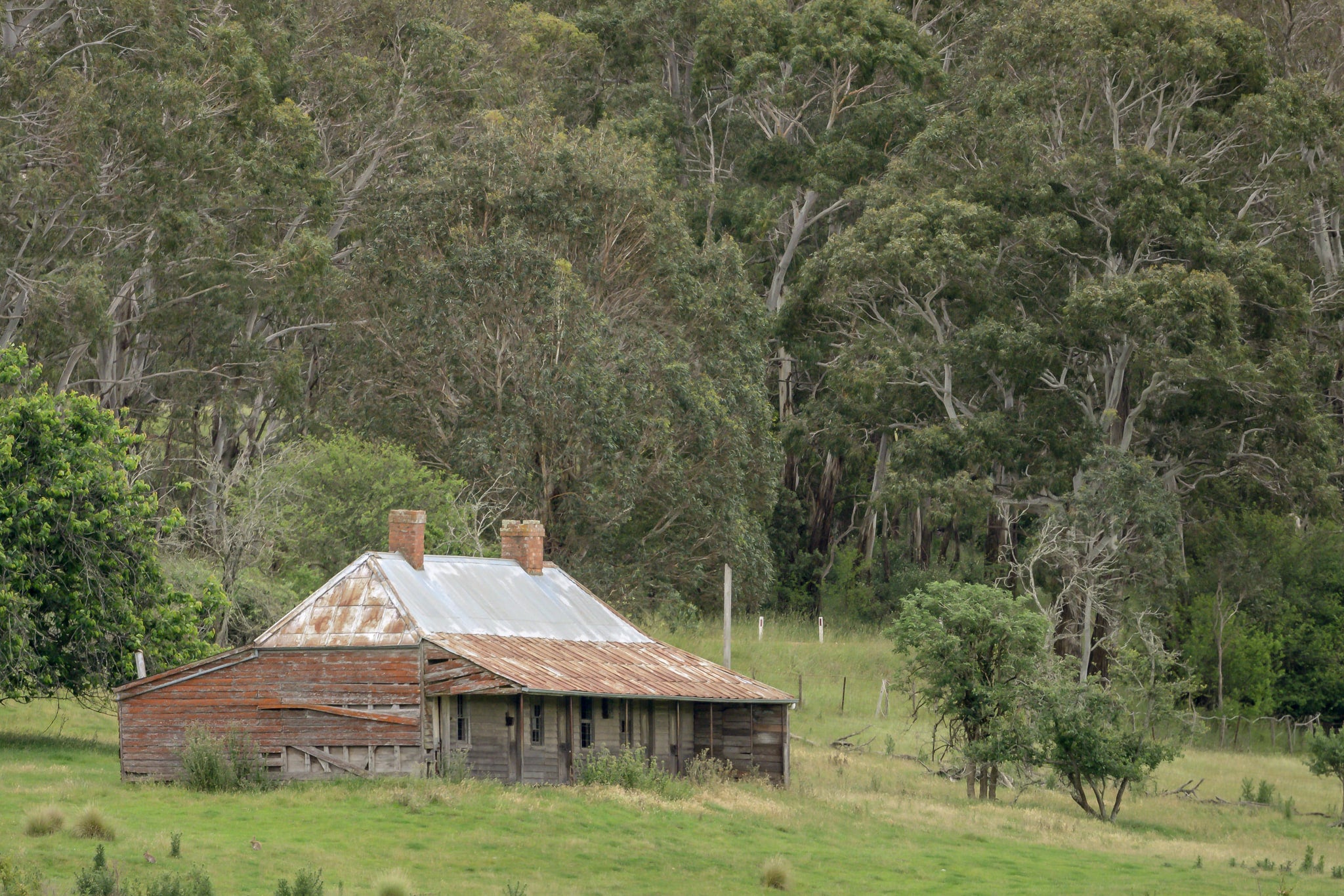 The Dragon Inn at A Place to Call Home, the historic Dragon Inn viewed across a field in Cathcart.