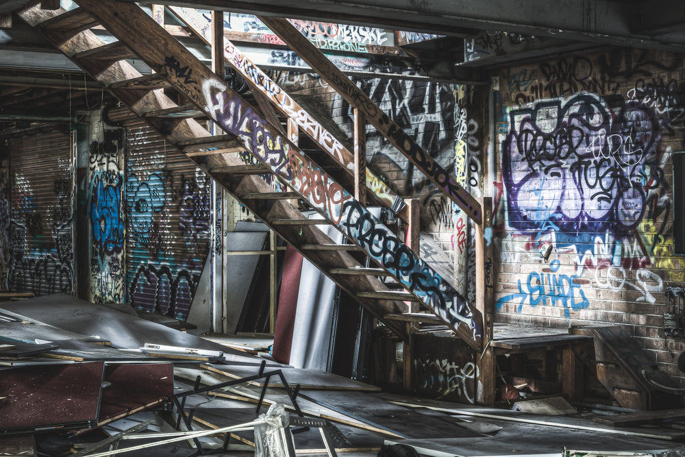 Main Floor To Mezzanine at Abandoned Bakery, a staircase leading from the main floor of the building to the mezzanine.