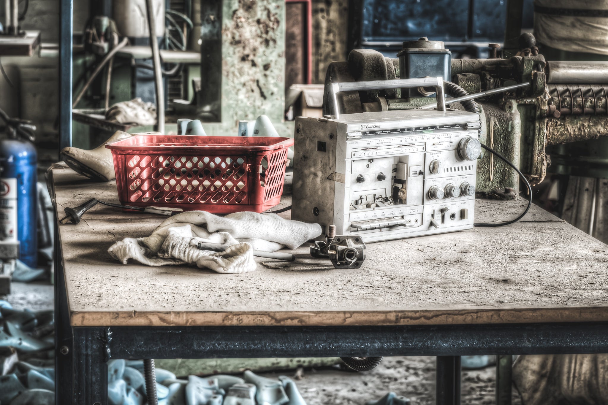 Radio at Abandoned Shoe Factory, a former workers old radio on one at the work benches.