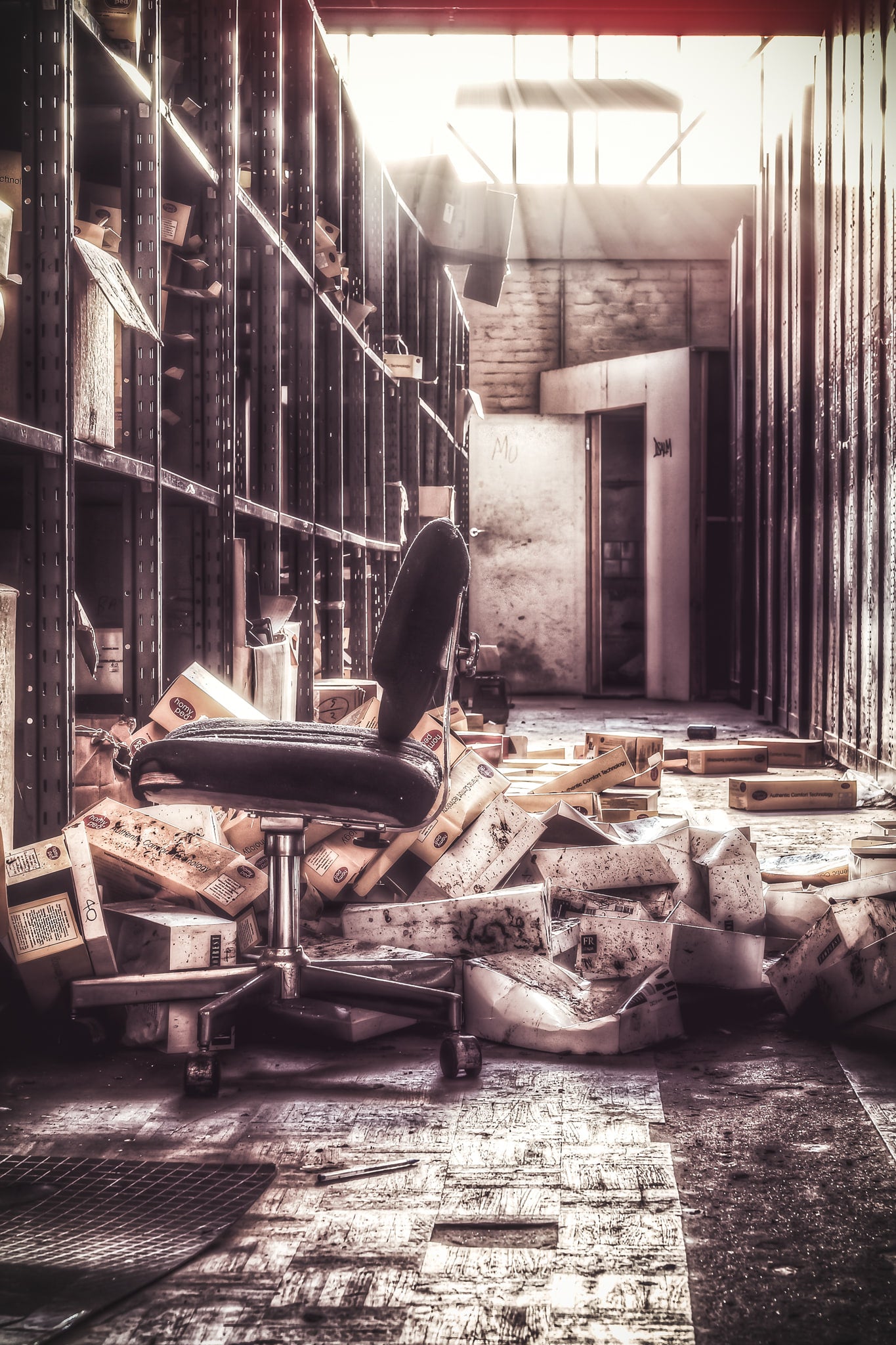 Storage Shelves at Abandoned Shoe Factory, racks of shelving used to store boxes of shoes.