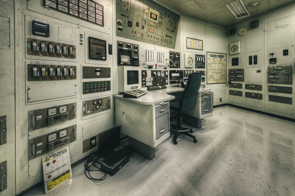 Control Room Cross View at ANSTO HIFAR, analogue gauge panels line three walls of the HIFAR control room at Lucas Heights.