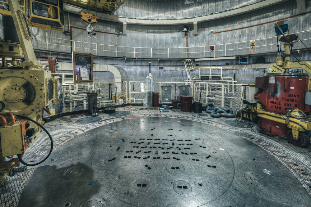 The Reactor Top Plate at ANSTO HIFAR, the red silicon flask on the right of the top plate was designed to safely lower.