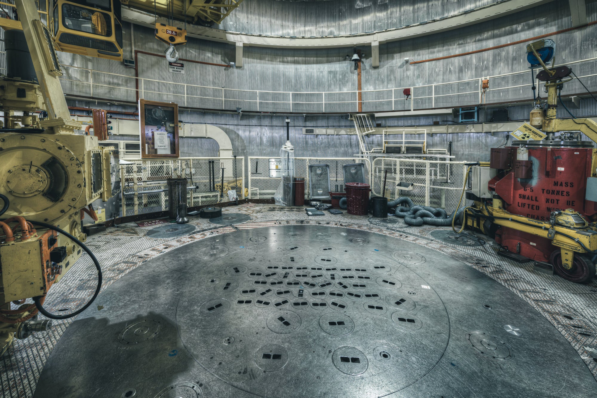 The Reactor Top Plate at ANSTO HIFAR, the red silicon flask on the right of the top plate was designed to safely lower.