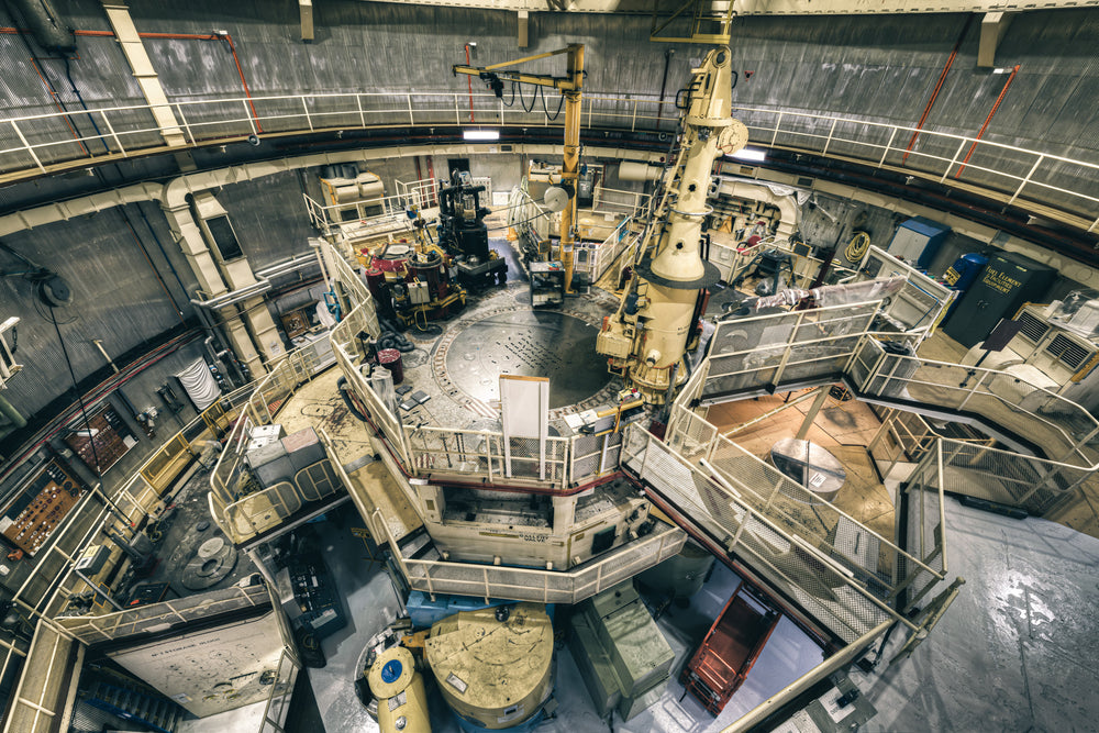 Top Plate View at ANSTO HIFAR, the reactor top plate sits at the centre of the containment hall, a broad steel disc studded.