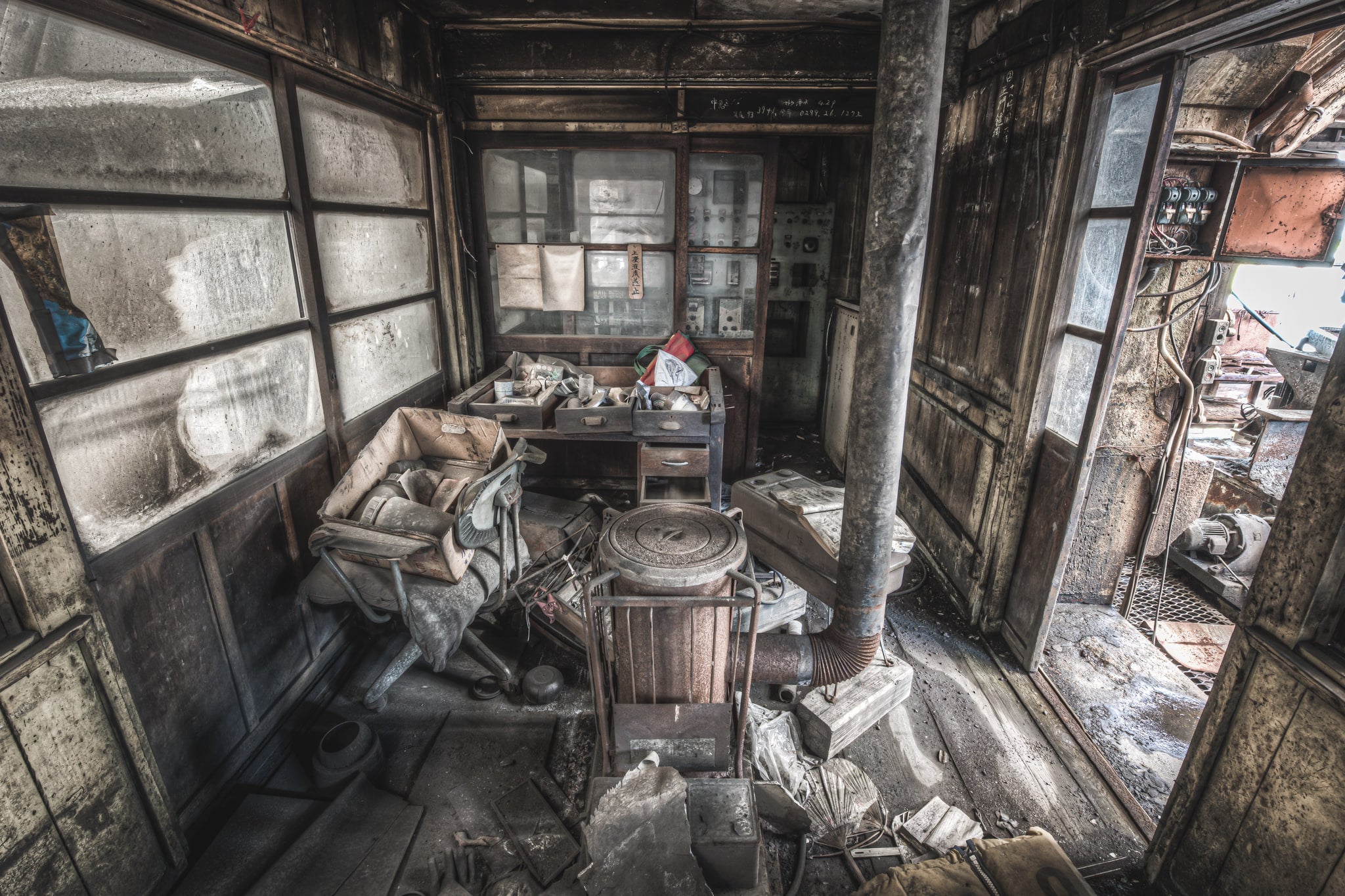 Managers Office at Ashio Copper Mine, a small timber-framed office crammed with debris.