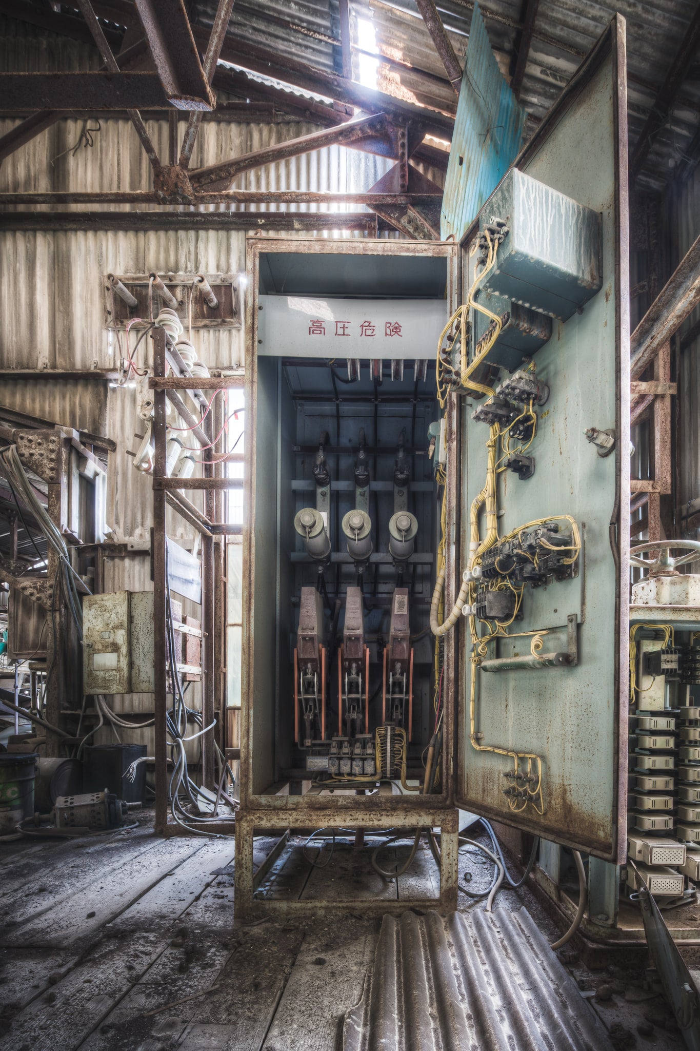 Switching Panel at Ashio Copper Mine, a high-voltage switching panel stands open inside a corrugated iron shed at the Ashio.