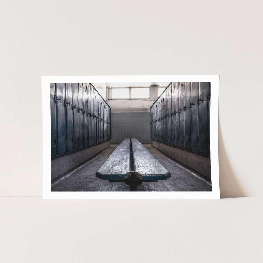 Rows of dark blue-grey metal lockers and a worn timber bench in the change room at Awaba Colliery, photographed in 2015.