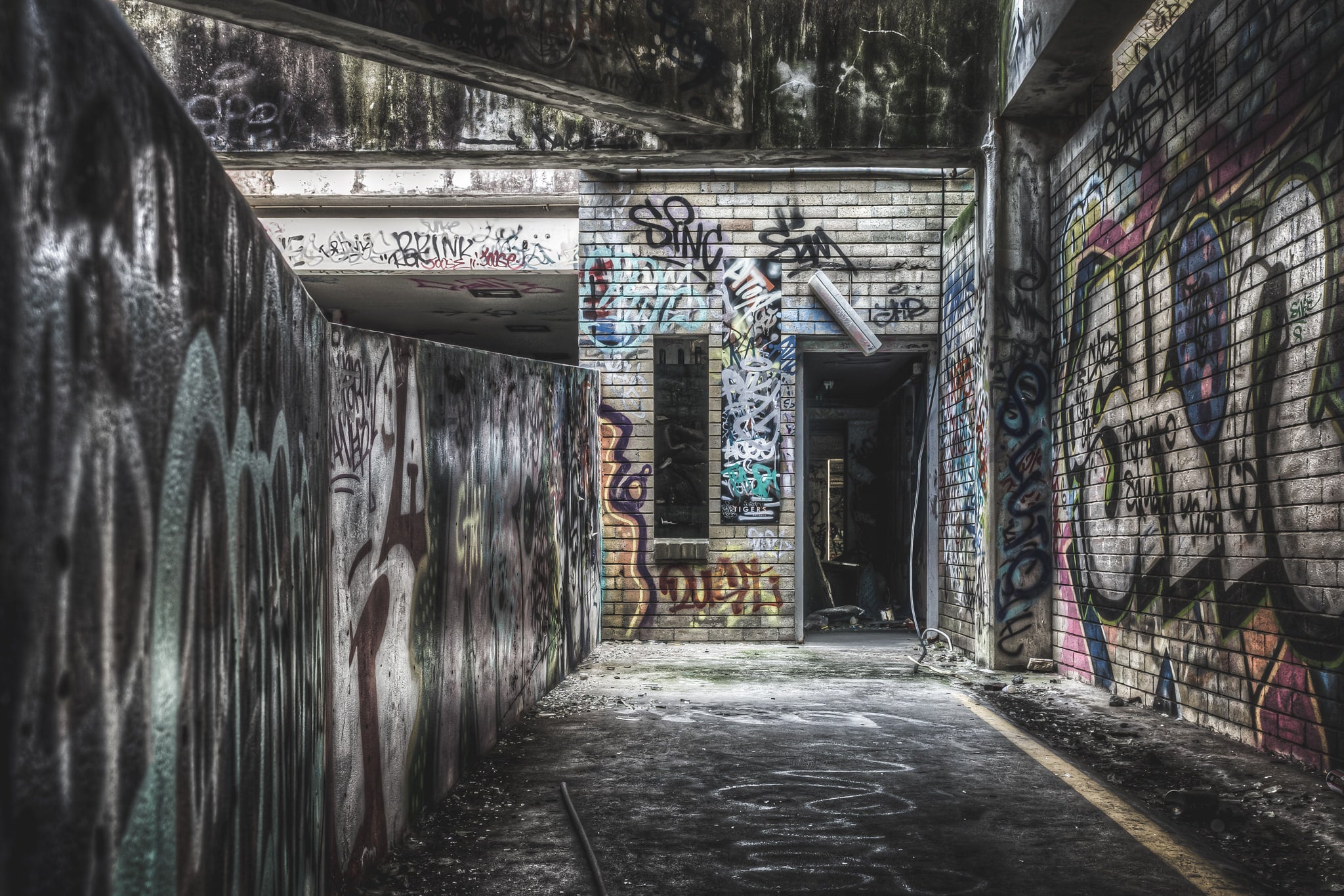 Fire Exit at Balmain Leagues Club, a low concrete ceiling presses down over a corridor deep inside the building.