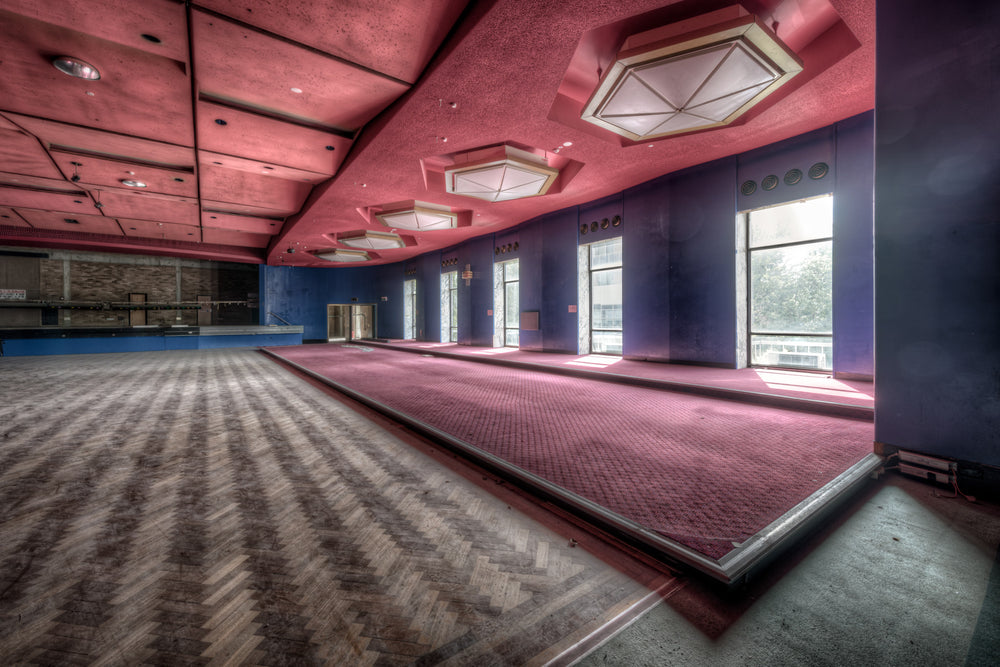 Auditorium Angled at Bankstown RSL, a raised stage sits at the far end of a vast function hall inside the Bankstown RSL.