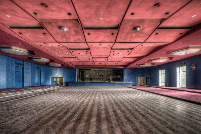 Auditorium at Bankstown RSL, a vast ballroom stretches toward a darkened stage at the far wall.