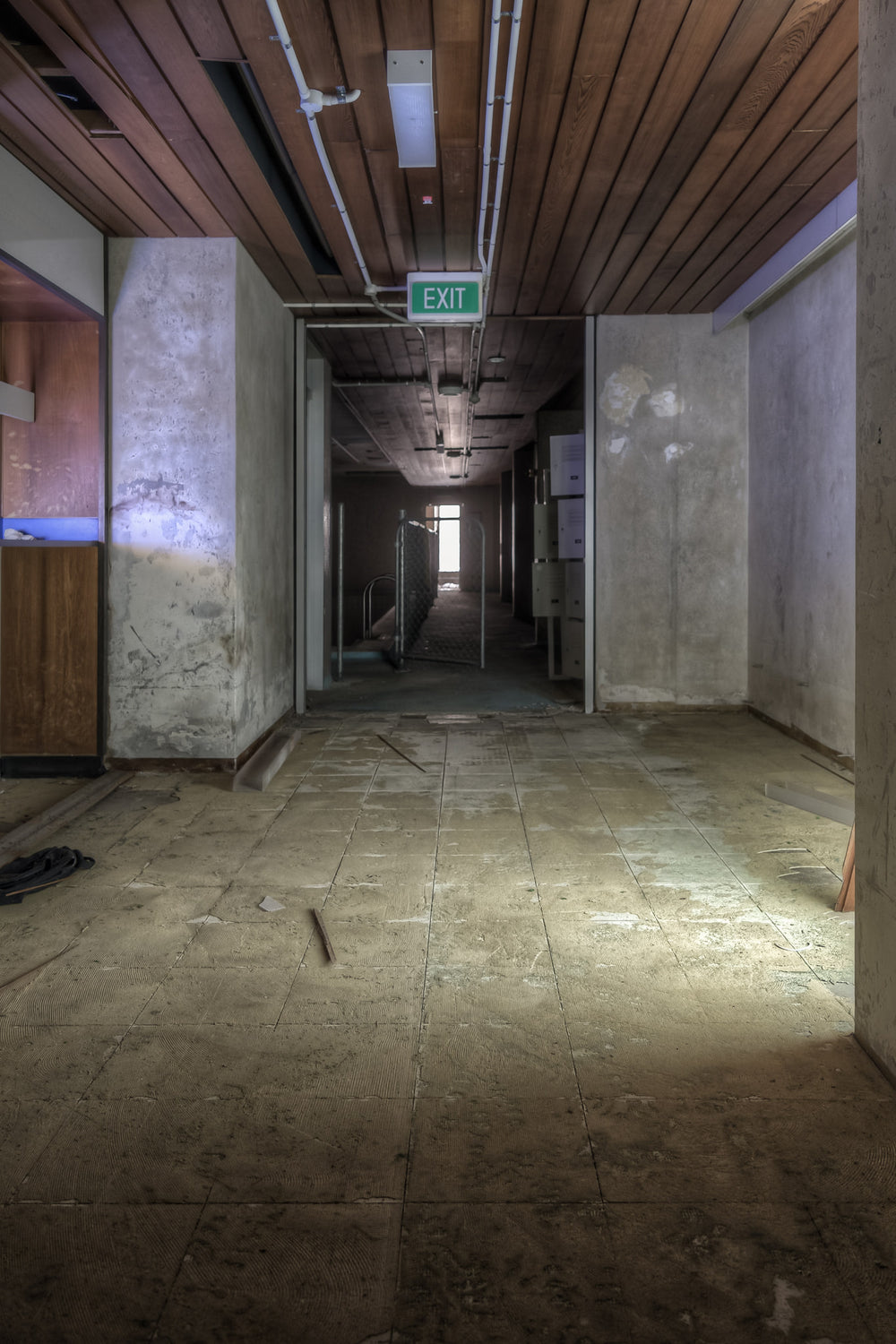 Change Rooms at Bankstown RSL, a long corridor stretches toward a distant source of natural light.