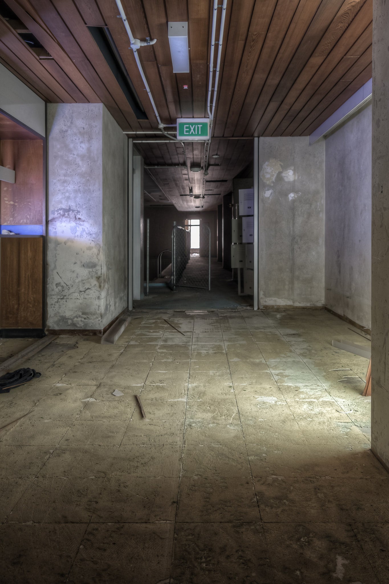 Change Rooms at Bankstown RSL, a long corridor stretches toward a distant source of natural light.