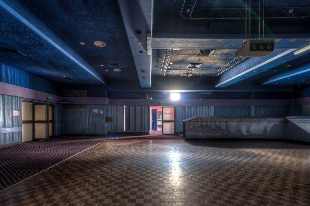 Nightclub Entrance at Bankstown RSL, a chequerboard dance floor stretches across the room, its surface slick under a single.