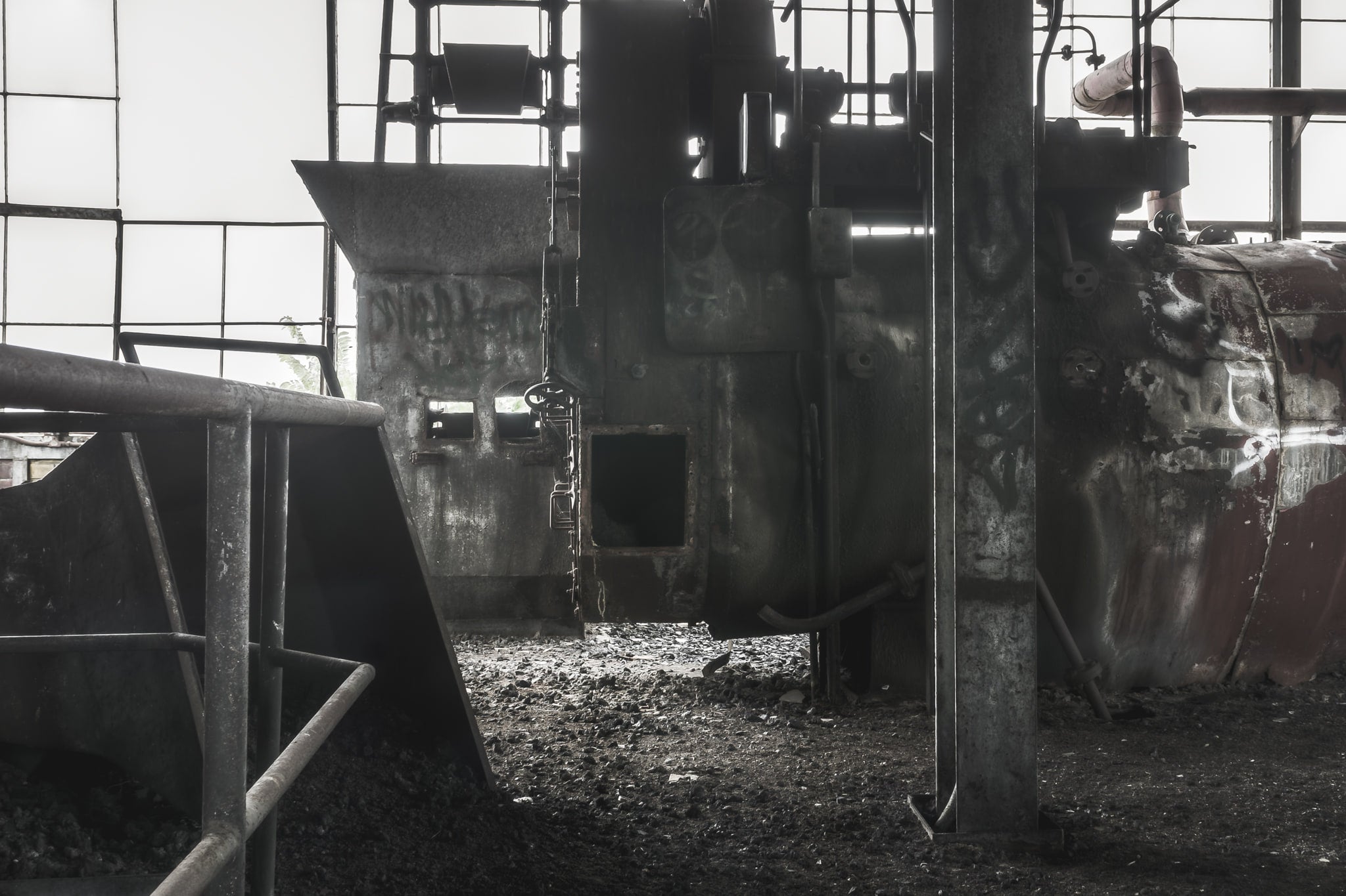 Pulveriser at Bathurst Gasworks, a steel pulverising unit stands centre frame, its heavy casing blackened with soot.
