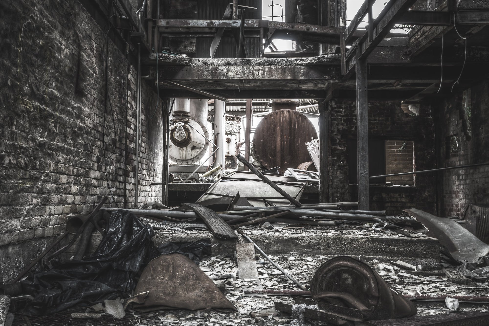 Purifier Shed at Bathurst Gasworks, broken steel and shattered brick cover the floor of the purifier shed.