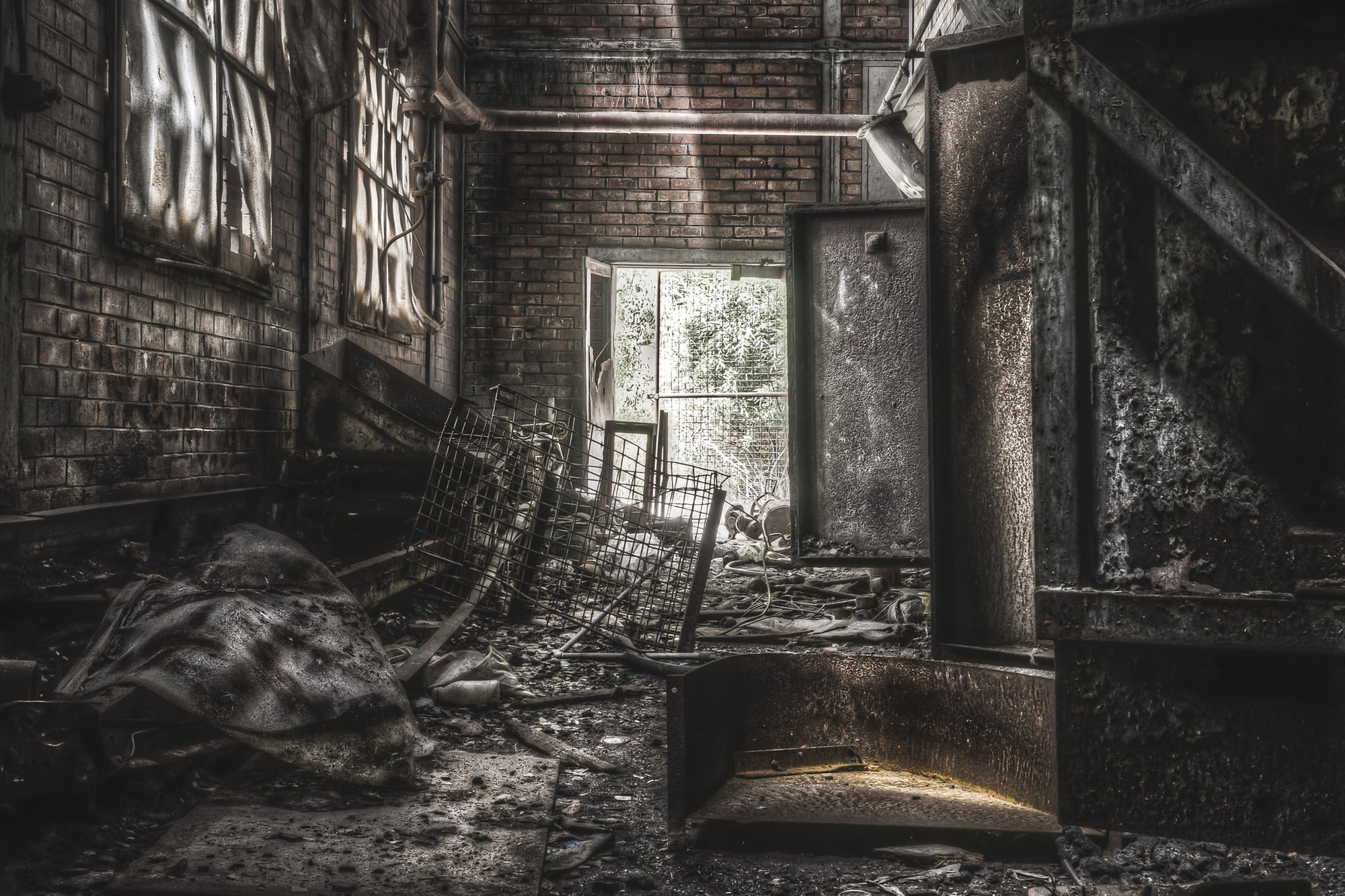 Retort Base at Bathurst Gasworks, light falls through a single doorway at the base of the retort house, catching the brick.
