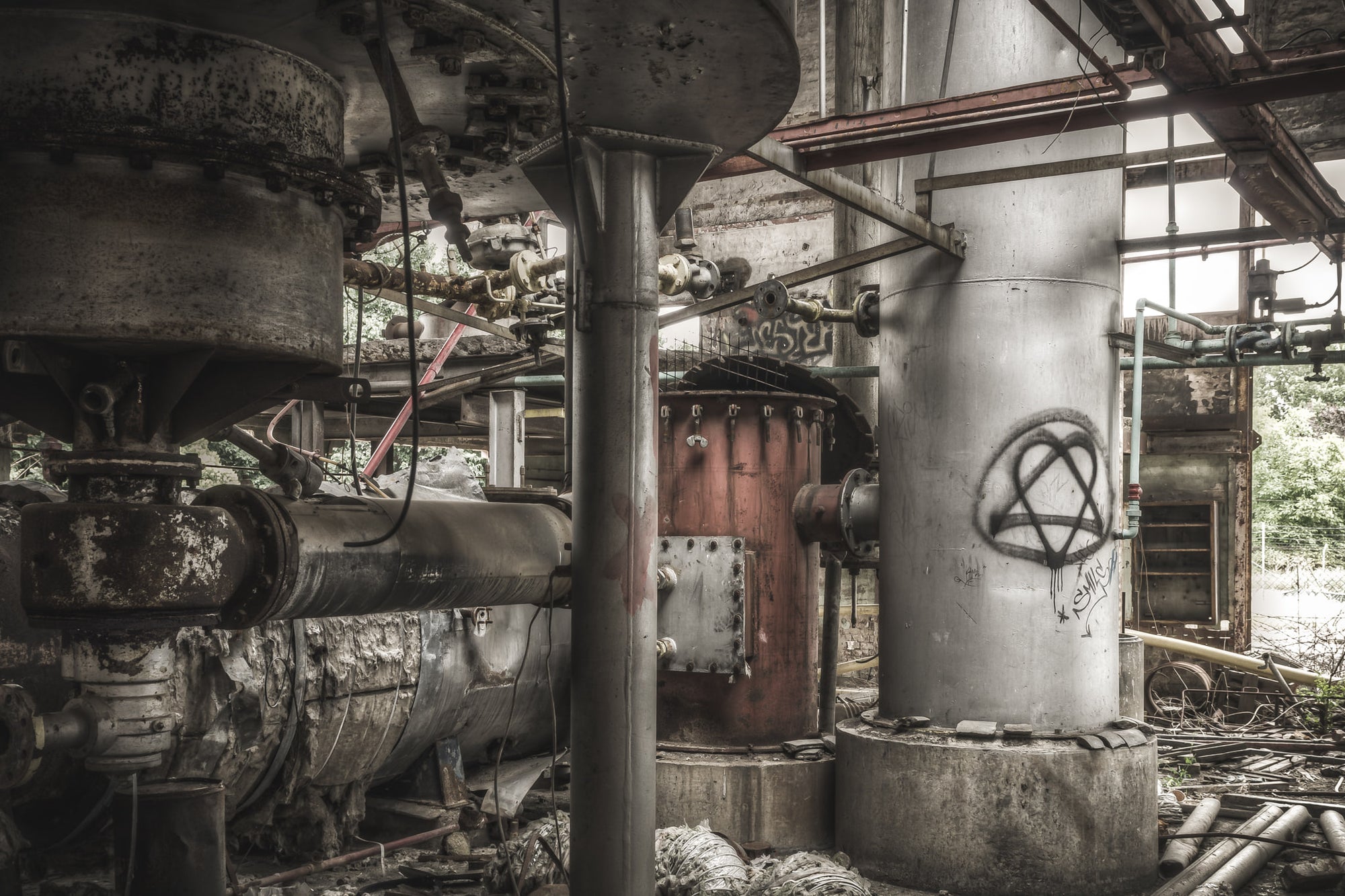 Scrubbers at Bathurst Gasworks, steel vessels and heavy flanged pipework crowd the interior of the gasworks scrubber house.