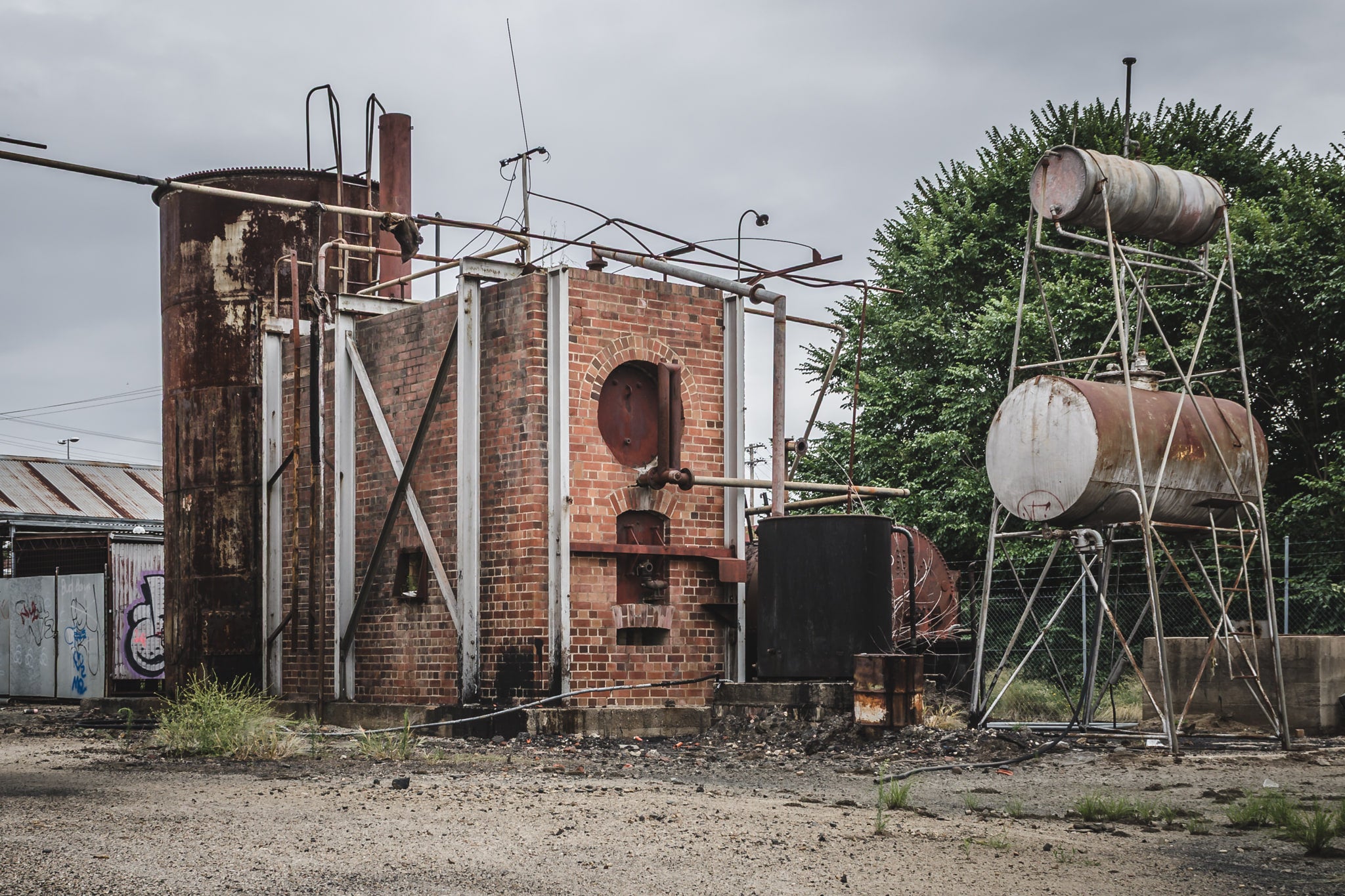 Tar Holding Structure at Bathurst Gasworks, a brick-clad boiler structure sits at the centre of the frame, its arched.
