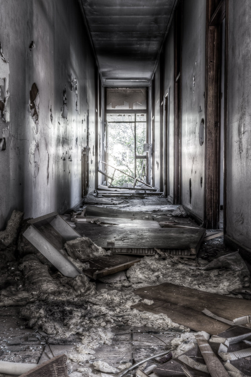 Office at Blayney Abattoir, this narrow hallway in the former office building is now scattered with ceiling panels.