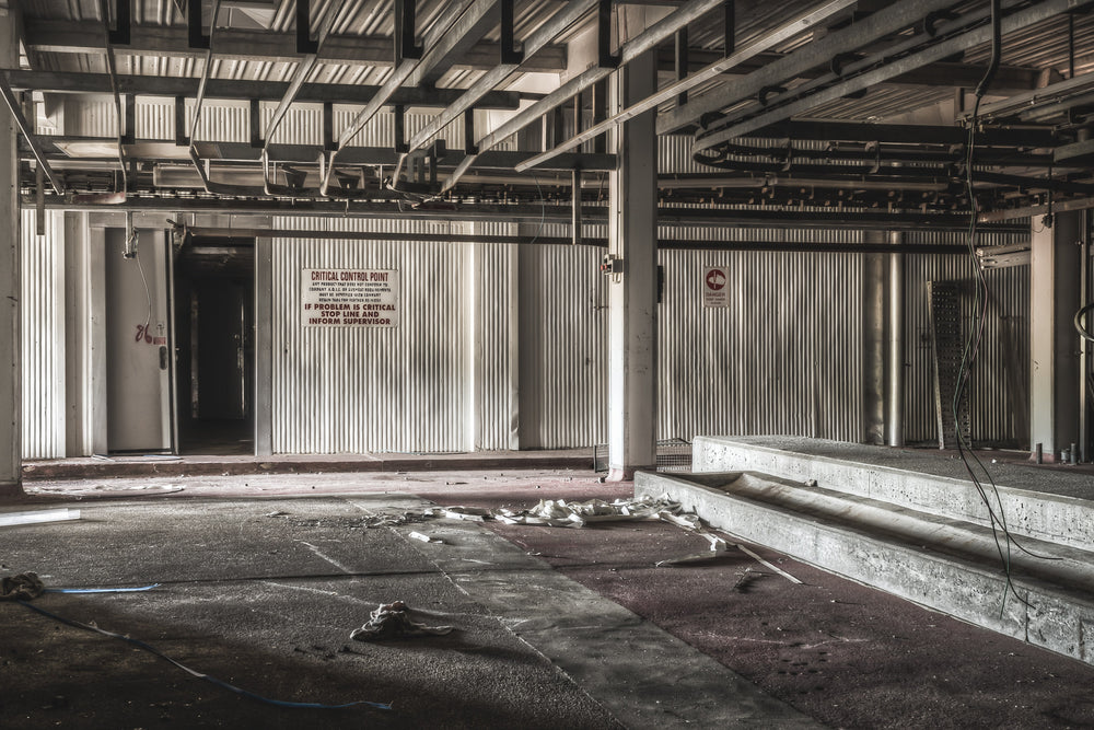 Pig Kill Floor at Blayney Abattoir, steel I-beams span the ceiling above corrugated metal walls.