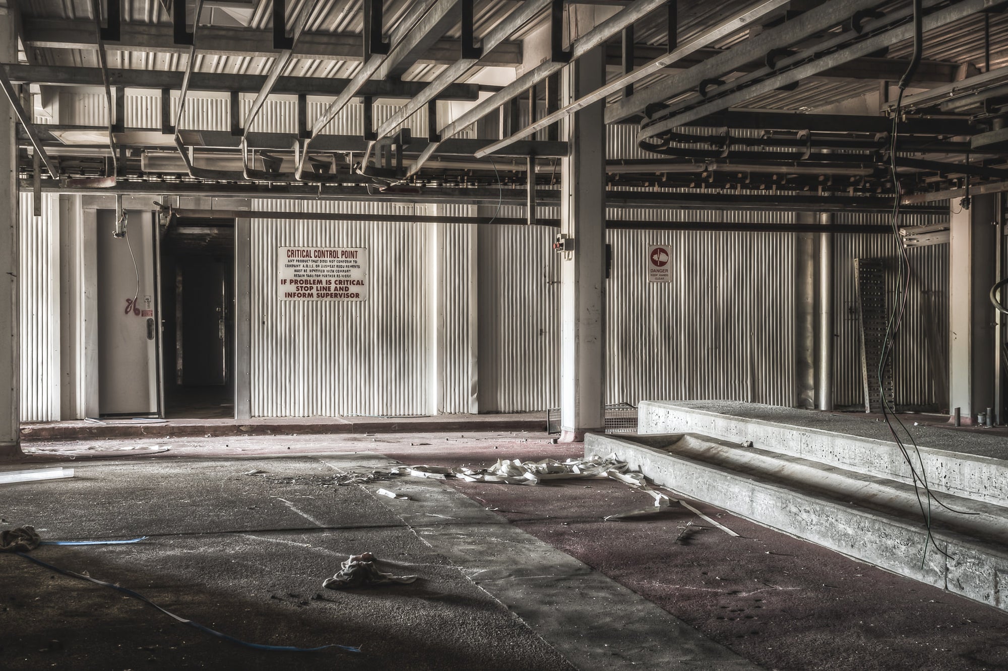 Pig Kill Floor at Blayney Abattoir, steel I-beams span the ceiling above corrugated metal walls.