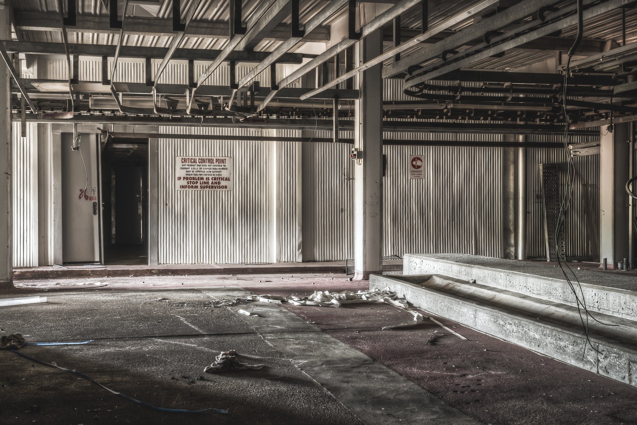 Pig Kill Floor at Blayney Abattoir, steel I-beams span the ceiling above corrugated metal walls.