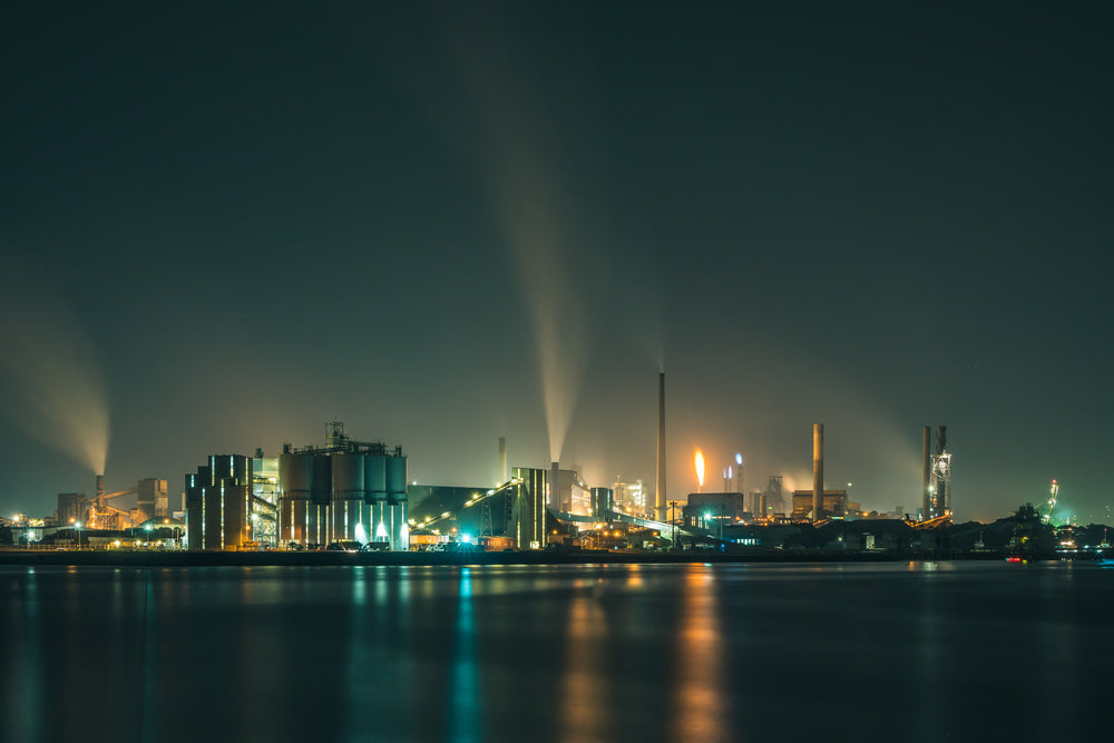 Port Kembla At Night at BlueScope Port Kembla, steam columns rise from the BlueScope steelworks and dissolve into low cloud.