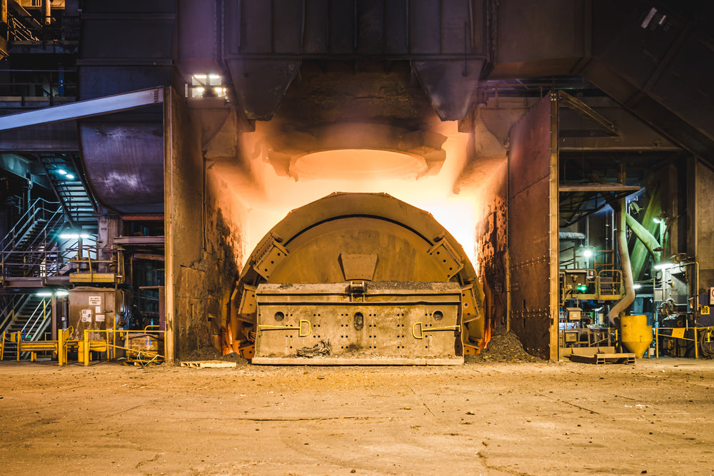 Steel Tapping at BlueScope Port Kembla, steel is poured into a ladle below by tipping the BOS on to the tapping hole side.