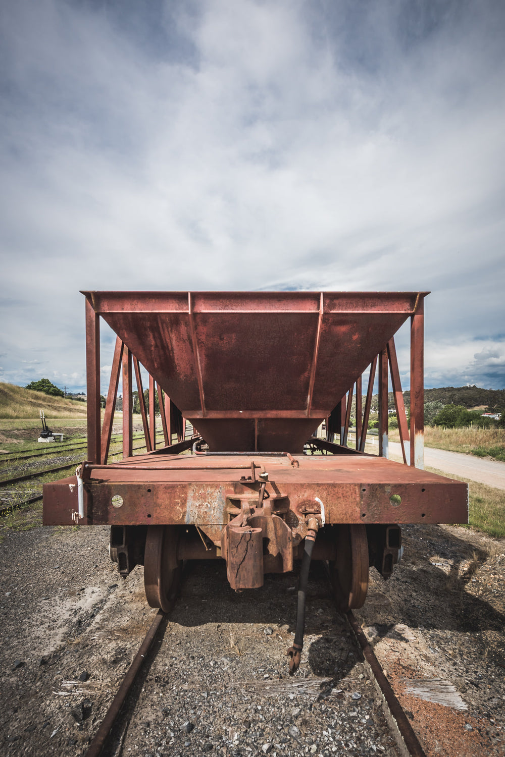 Ballast End Truck at Bombala Station, a ballast hopper wagon sits square on narrow-gauge track, shot head-on at coupling.