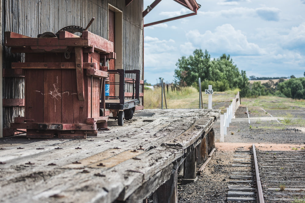 Goods Shed Flooring at Bombala Station, heavy timber decking runs the length of the platform, its surface split.
