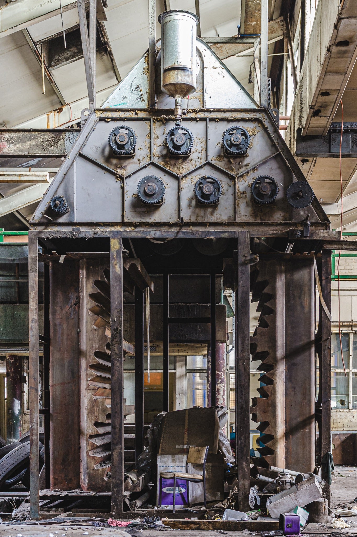 Large interlocking helical gears mounted in a triangular steel housing, photographed inside the former Davies Coop / Bradmill factory at Yarraville.