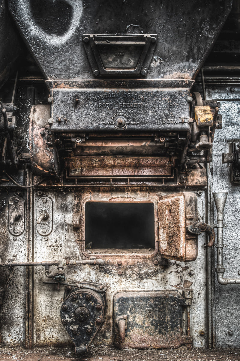 A Babcock Detroit Roto-Feeder with its cast iron face blackened by coal dust and rust inside the abandoned Bradmill Denim factory, Yarraville.