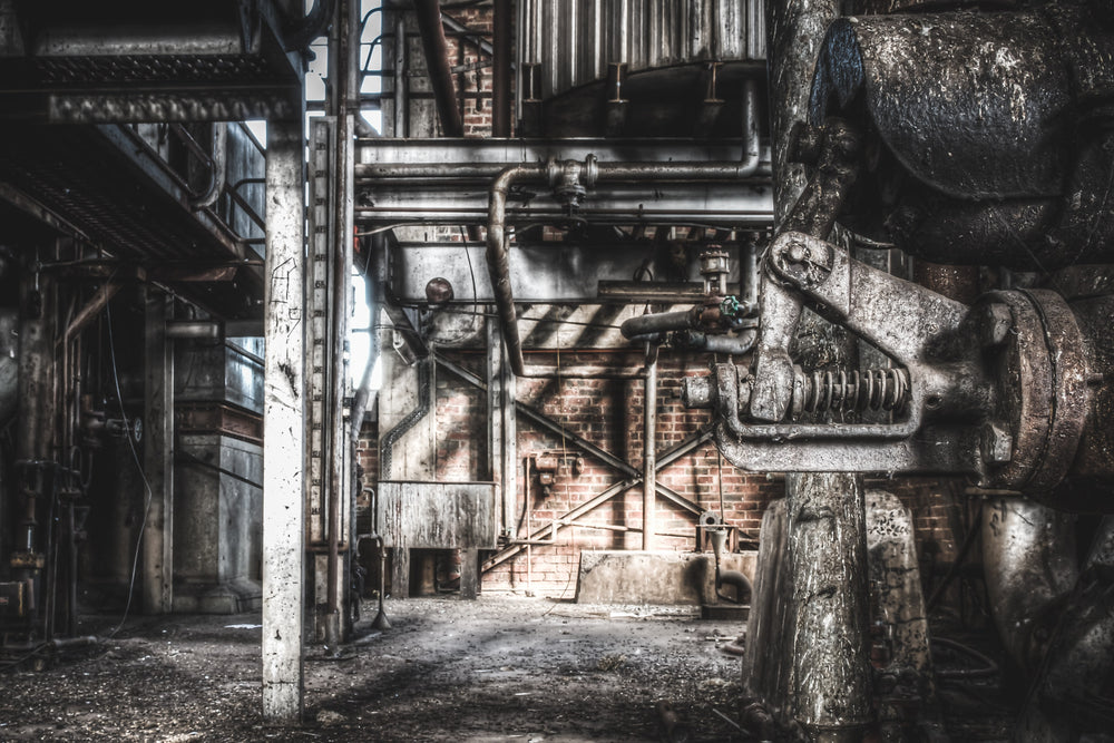 Spring Valve at Bradmill Denim, a heavy cast-iron valve assembly dominates the right of frame, its spring mechanism coiled.