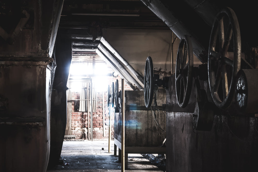 Valves at Bradmill Denim, cast-iron valve wheels line a steel manifold, their spokes thick with grease and grime.