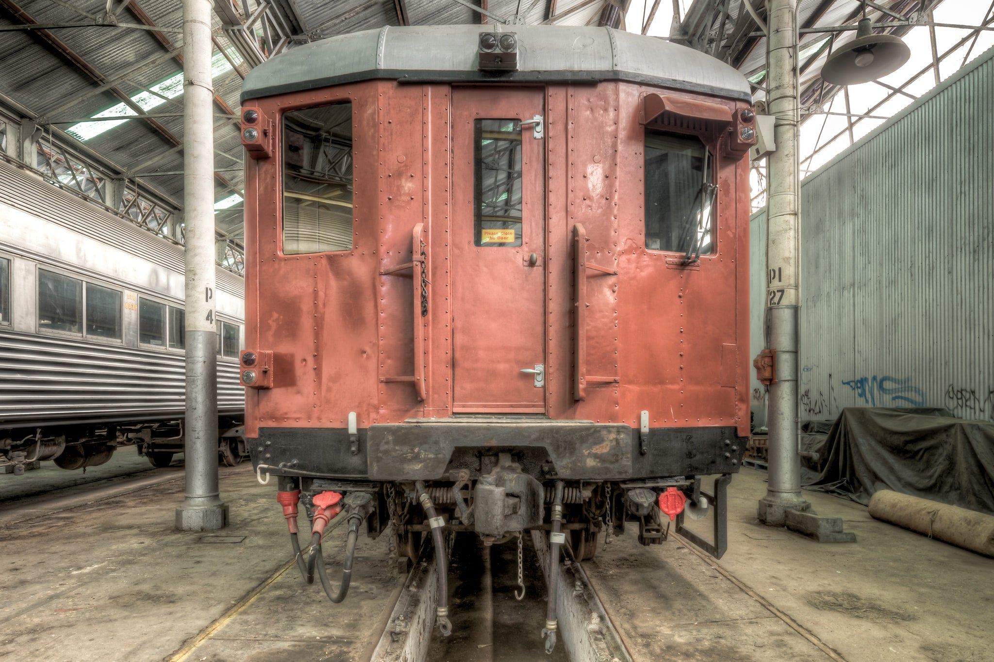 4052 Exterior at Eveleigh Paint Shop, a riveted steel carriage sits square on the tracks inside the Eveleigh Paint Shop.