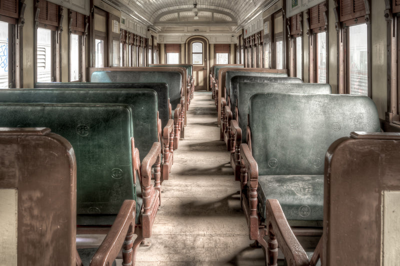 Centurion at Eveleigh Paint Shop, green leather seat backs line both sides of a narrow central aisle.