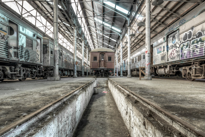 Within the Eveleigh Paint Shop, a concrete inspection pit plunges into the floor. It recalls the industrial scale of Sydney's railway workshops, where carriages were painted and finished from 1887.