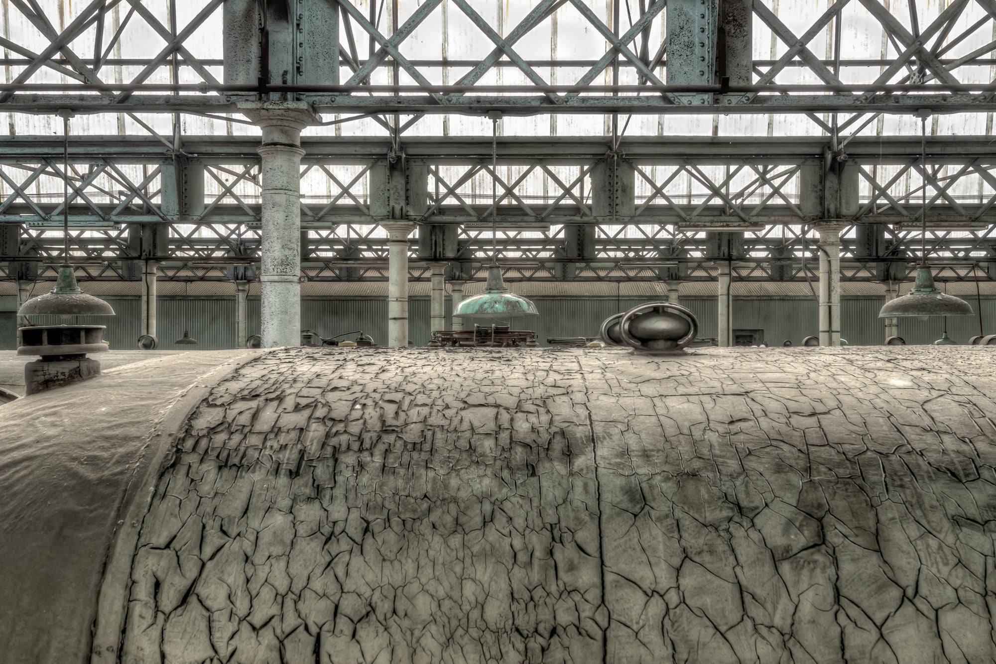 Roof Covering at Eveleigh Paint Shop, the cracked surface of a railway carriage roof fills the foreground.