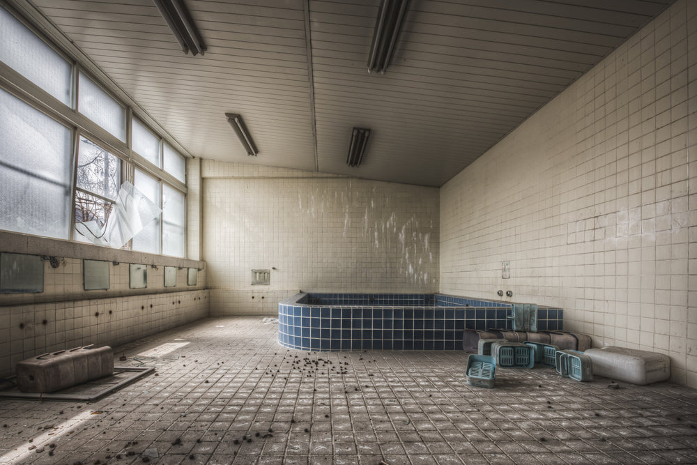 Boys Yokosu at Family School Fureai, a communal bathing room tiled floor to ceiling in white ceramic squares.