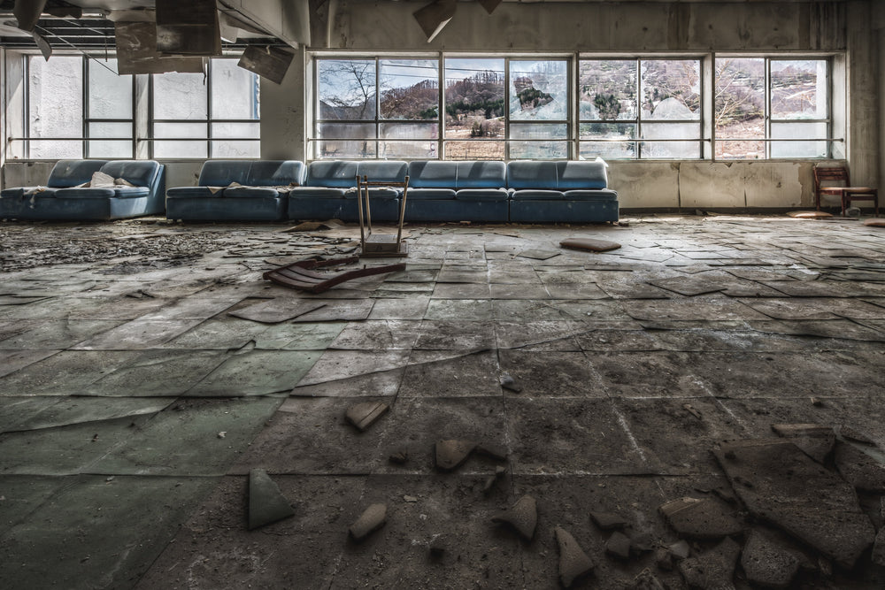 Mountain View at Family School Fureai, blue vinyl couches line the far wall beneath a bank of large windows.