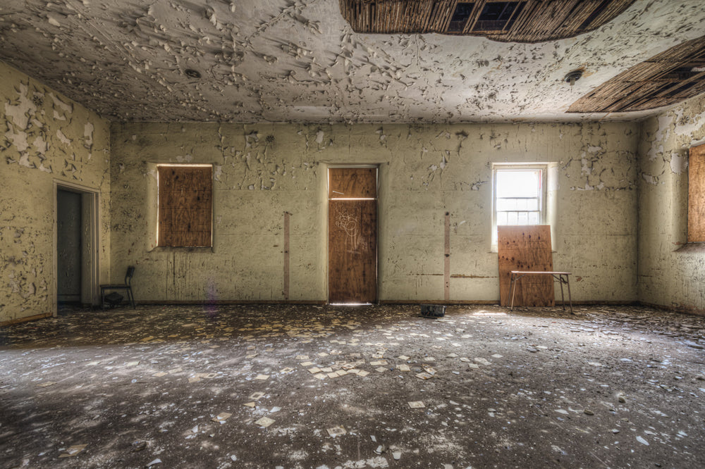 Boarded Up at Female Ward 9 & 10, a large room stripped bare.