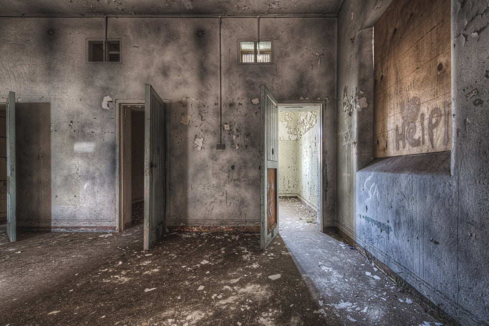 Help at Female Ward 9 & 10, three open doors in a heavily decayed room of the Callan Park Female Ward.