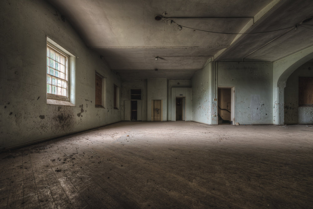 Soft Light at Female Ward 9 & 10, a single window throws pale light across a bare concrete floor.
